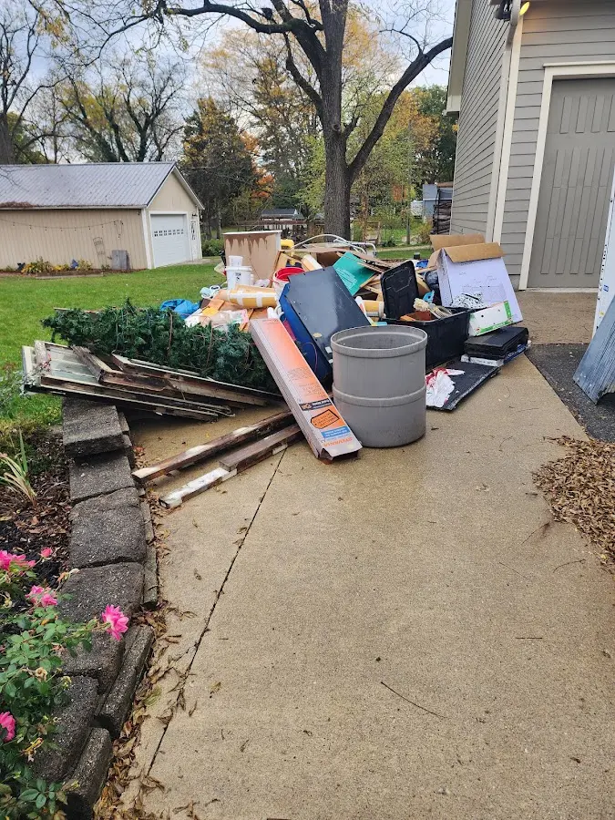 Dumpster being loaded with debris for 30 Yard Dumpster Rental in Hillview